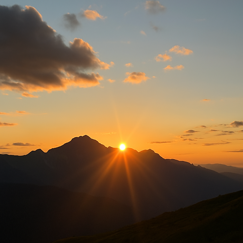 A radiant sunrise breaking over a mountain ridge, symbolizing hope and new beginnings.
